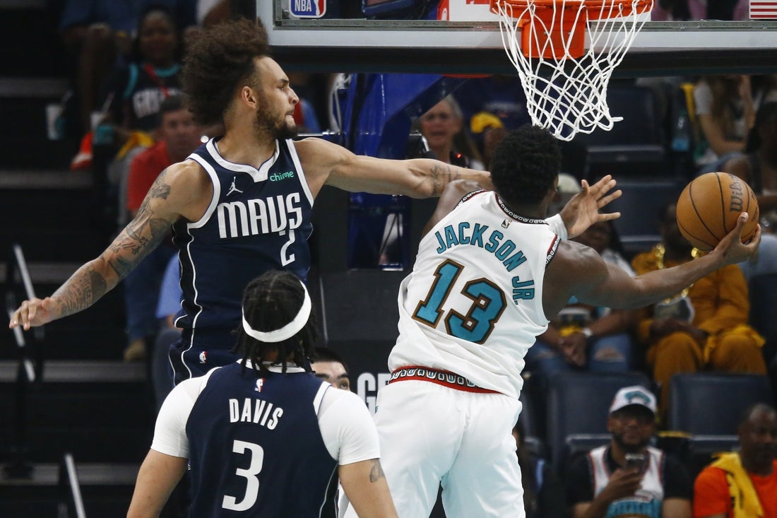 Apr 18, 2025; Memphis, Tennessee, USA; Dallas Mavericks center Dereck Lively II (2) defends Memphis Grizzlies forward Jaren Jackson Jr. (13) during the second quarter at FedExForum. Mandatory Credit: Petre Thomas-Imagn Images