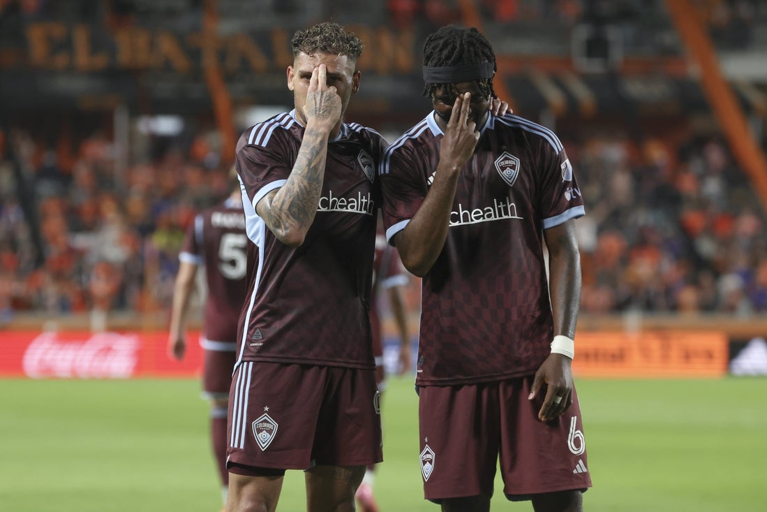 Apr 19, 2025; Houston, Texas, USA; Colorado Rapids forward Rafael Navarro (9) and defender Chidozie Awaziem (6) pose for a picture after Navarro scores a goal during the second half against Houston Dynamo FC at Shell Energy Stadium. Mandatory Credit: Troy Taormina-Imagn Images