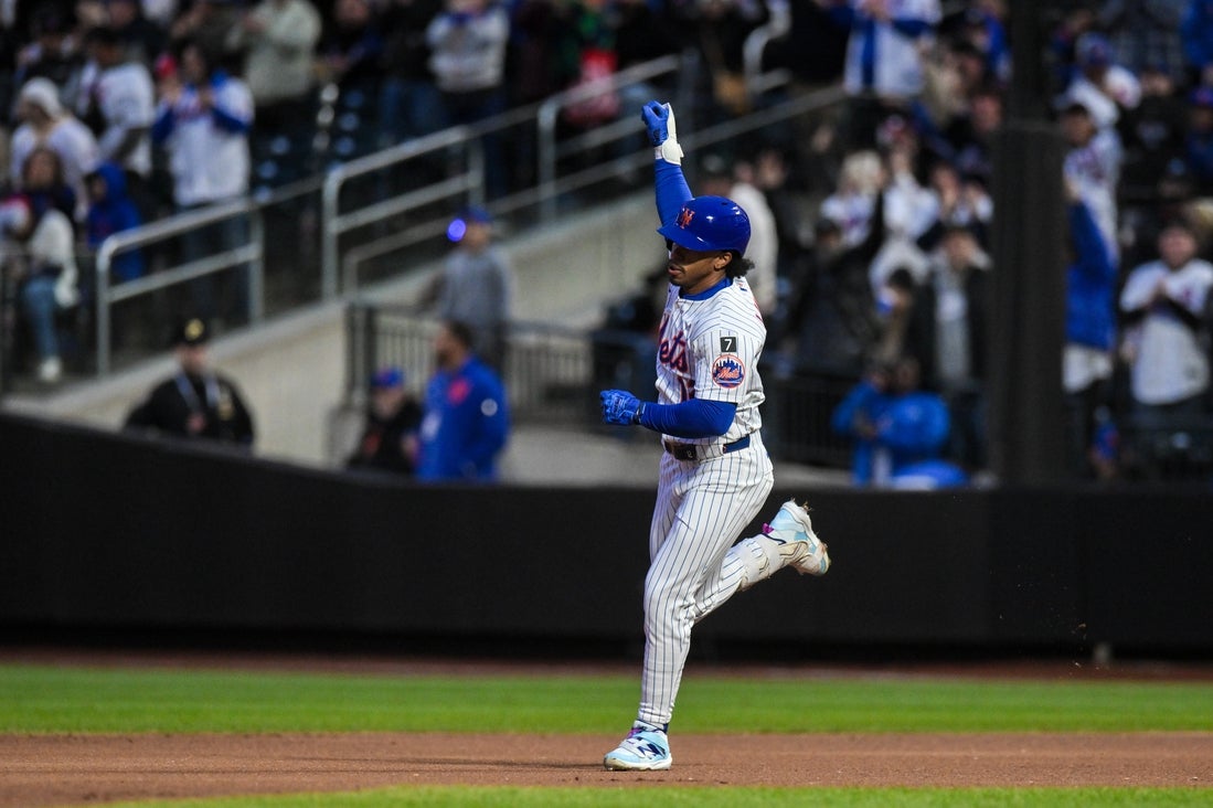 Apr 21, 2025; New York City, New York, USA; New York Mets shortstop Francisco Lindor (12) reacts after hitting a solo home run against the Philadelphia Phillies during the first inning at Citi Field. Mandatory Credit: John Jones-Imagn Images
