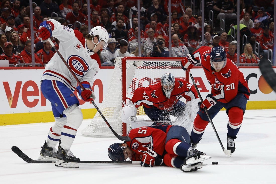 Apr 21, 2025; Washington, District of Columbia, USA;Washington Capitals defenseman Trevor van Riemsdyk (57) blocks a shot in front of Montreal Canadiens center Christian Dvorak (28), Washington Capitals center Lars Eller (20) and Capitals goaltender Logan Thompson (48) in the second period in game one of the first round of the 2025 Stanley Cup Playoffs at Capital One Arena. Mandatory Credit: Geoff Burke-Imagn Images