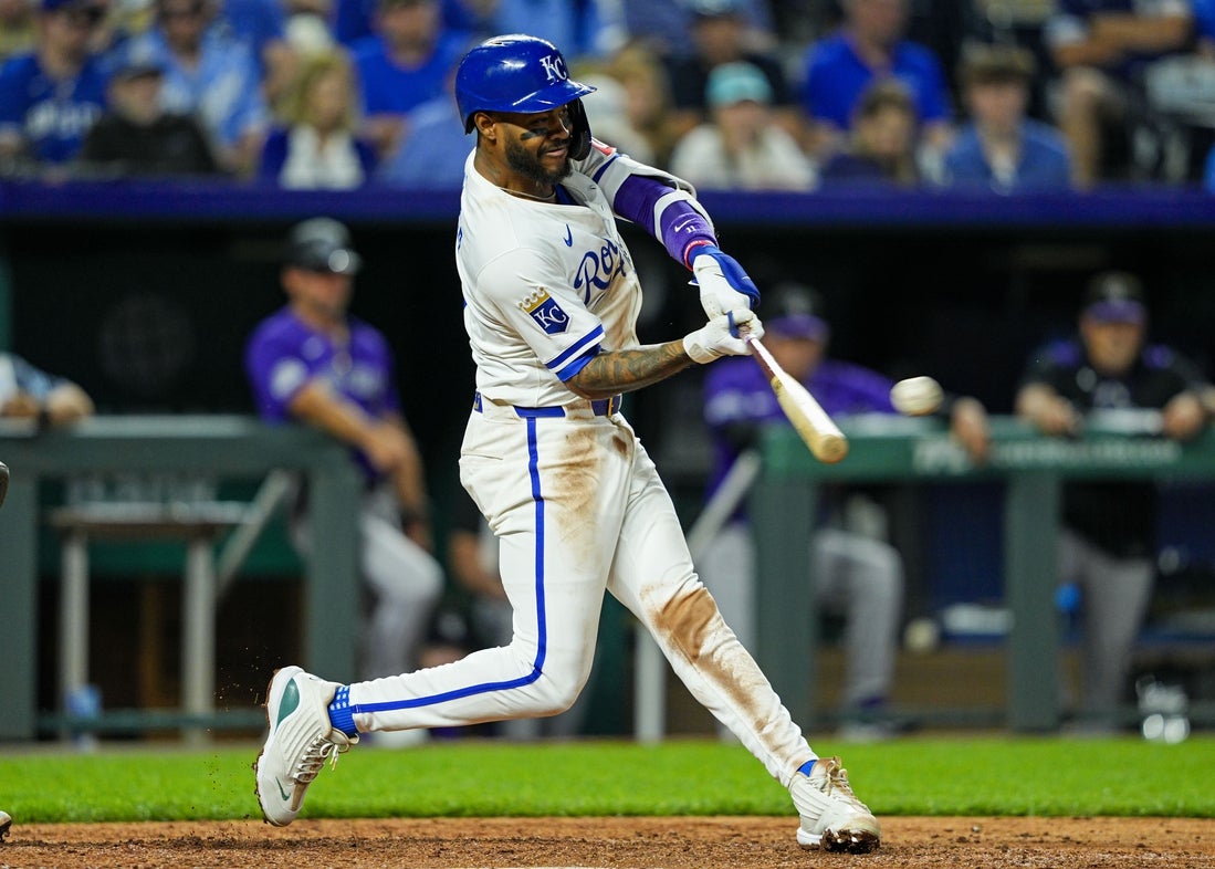Apr 22, 2025; Kansas City, Missouri, USA; Kansas City Royals third baseman Maikel Garcia (11) hits a double during the ninth inning against the Colorado Rockies at Kauffman Stadium. Mandatory Credit: Jay Biggerstaff-Imagn Images