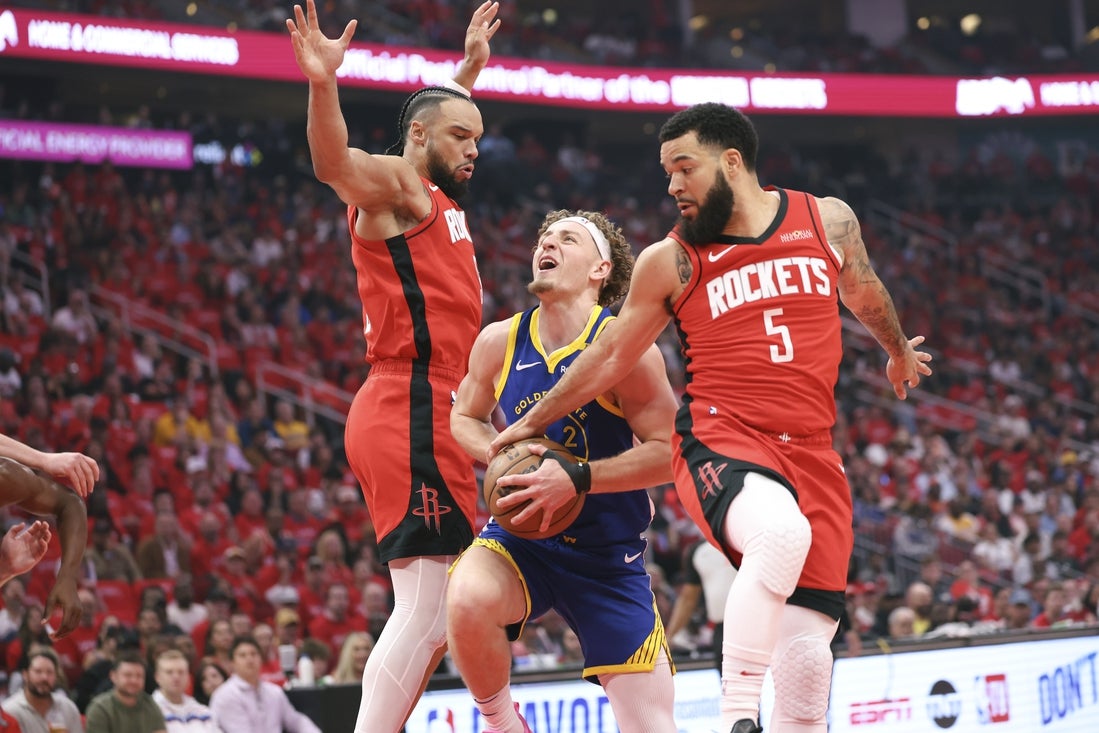Apr 23, 2025; Houston, Texas, USA; Houston Rockets forward Dillon Brooks (9) and guard Fred VanVleet (5) defend against Golden State Warriors guard Brandin Podziemski (2) during the first quarter during game two of the first round for the 2024 NBA Playoffs at Toyota Center. Mandatory Credit: Troy Taormina-Imagn Images