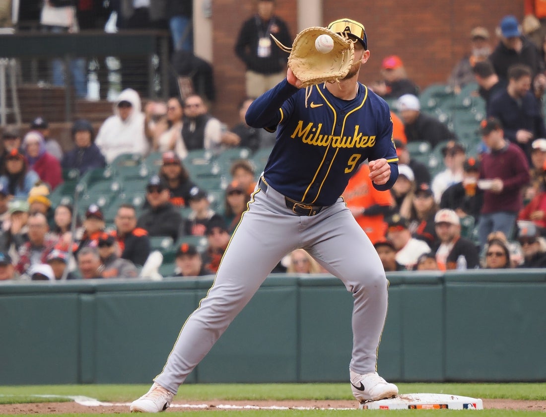 Apr 24, 2025; San Francisco, California, USA; Milwaukee Brewers first baseman Jake Bauers (9) catches the ball against the San Francisco Giants during the second inning at Oracle Park. Mandatory Credit: Kelley L Cox-Imagn Images