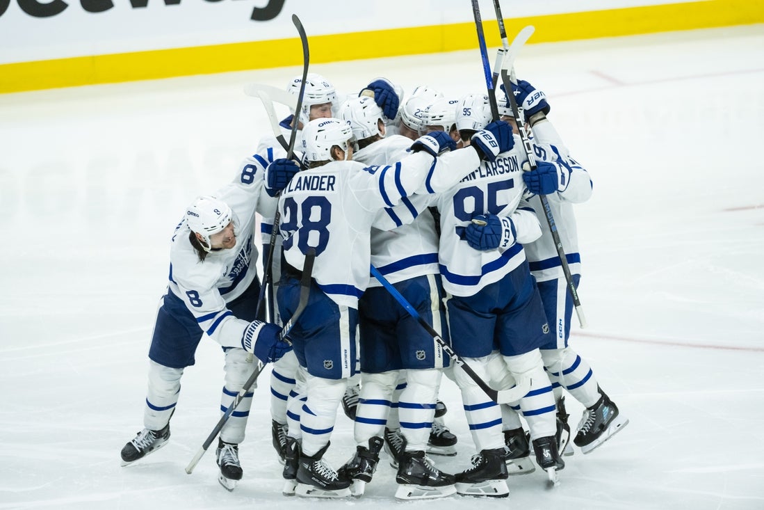 Apr 24, 2025; Ottawa, Ontario, CAN; The Toronto Maple Leafs celebrate a goal scored by defenseman Simon Benoit (2) in overtime against the Ottawa Senators in game three of the first round of the 2025 Stanley Cup Playoffs at Canadian Tire Centre. Mandatory Credit: Marc DesRosiers-Imagn Images