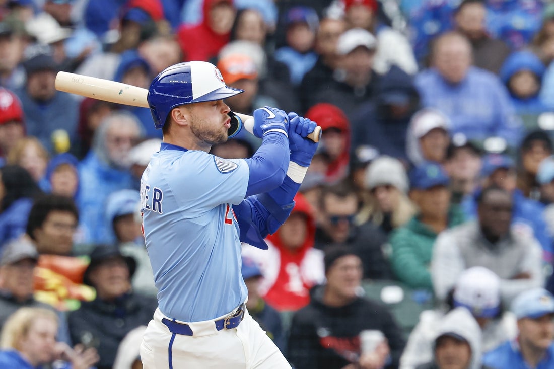 Apr 25, 2025; Chicago, Illinois, USA; Chicago Cubs second baseman Nico Hoerner (2) hits an RBI-single against the Philadelphia Phillies during the third inning at Wrigley Field. Mandatory Credit: Kamil Krzaczynski-Imagn Images