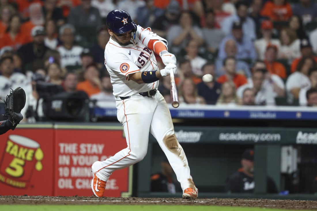 Apr 29, 2025; Houston, Texas, USA; Houston Astros third baseman Isaac Paredes (15) hits an RBI triple during the seventh inning against the Detroit Tigers at Daikin Park. Mandatory Credit: Troy Taormina-Imagn Images