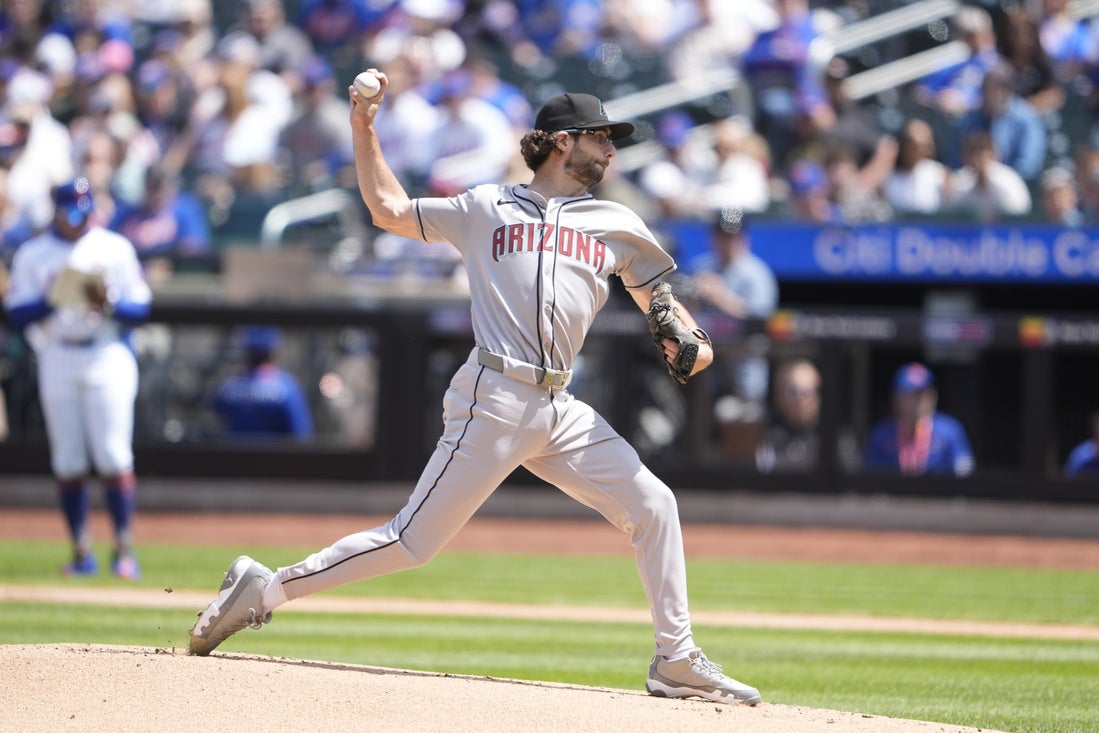 May 1, 2025; New York City, New York, USA; Arizona Diamondbacks pitcher Zac Gallen (23) delivers a pitch against the New York Mets during the first inning at Citi Field. Mandatory Credit: Gregory Fisher-Imagn Images